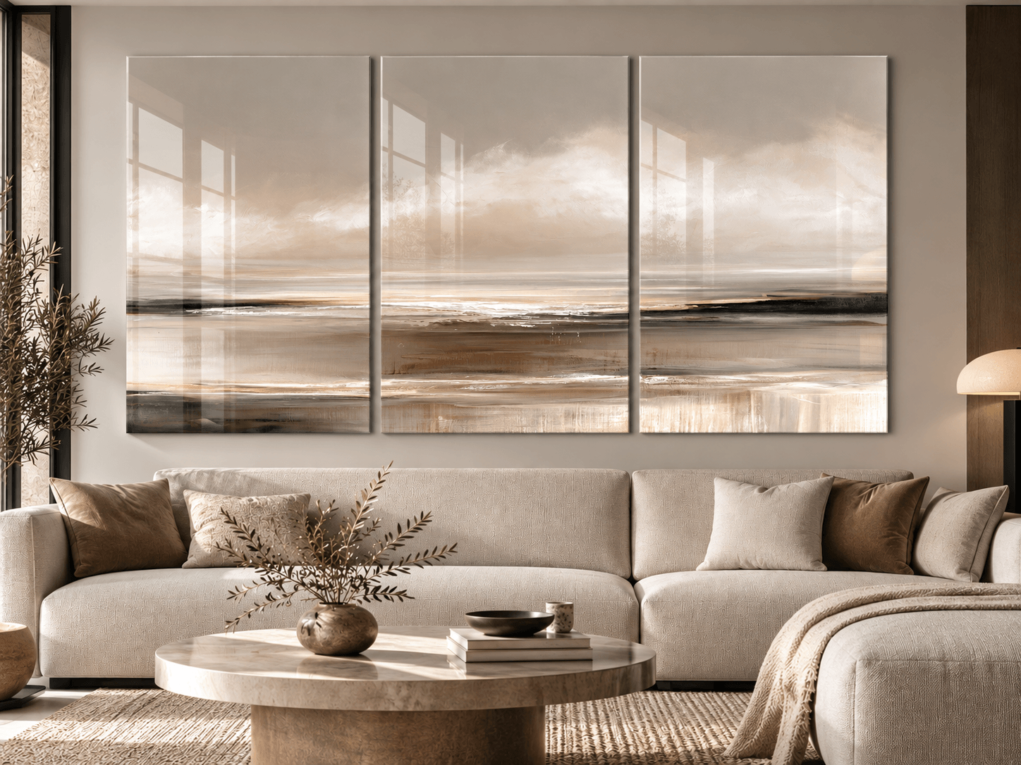 Warm-toned 3-piece landscape glass wall art above a beige sectional sofa in a living room